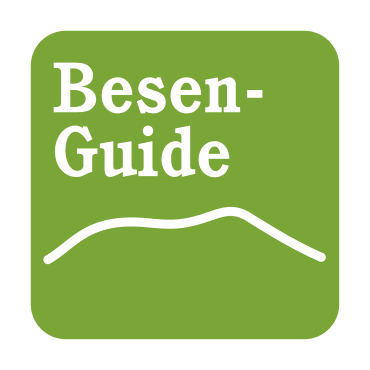 Ein grünes Icon mit der weißen Aufschrift "Besen-Guide" und einer geschwungenen Linie darunter.